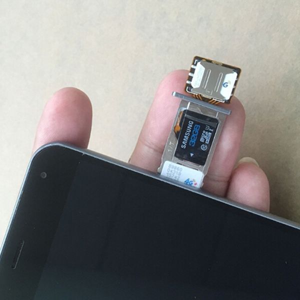 Адаптер nanoSIM-nanoSIM, который позволит одновременно использовать две Nano-SIM карты и MicroSD карту памяти 4411 фото